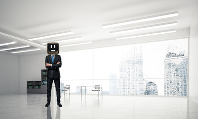 Businessman with an old TV instead of head.