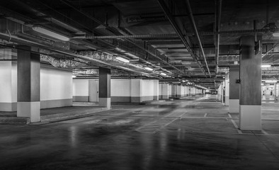 Empty car parking, new interiors spaces. Black and white photo