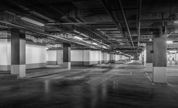 Empty car parking, new interiors spaces. Black and white photo
