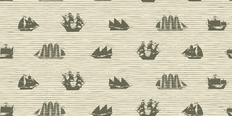 Vector seamless background on the theme of sea travel with various sailing ships. Sea objects on the striped background in retro style