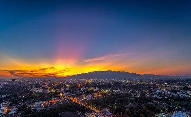 Fototapeta na wymiar CHIANG MAI, THAILAND- JANUARY 13, 2019 : Landscape of Chiang Mai City with sunset and building in twilight sky.