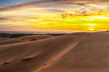 Fototapeta na wymiar Red sand dunes in sunset at Binh Thuan near the town of Mui Ne, Vietnam. Mui Ne is popular travel destination .