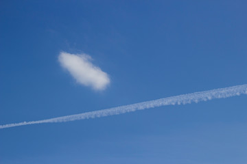 Clouds in the sky. Blue sky. The line from the plane. Beautiful sky.