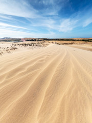 White sand dunes and blue sky background in Mui Ne , South of Vietnam