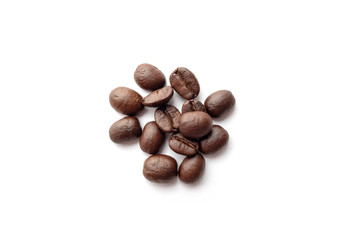 Roasted coffee beans isolated on white background. Close-up.