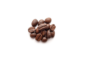 Roasted coffee beans isolated on white background. Close-up.