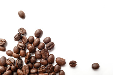 Roasted coffee beans isolated on white background. Close-up.