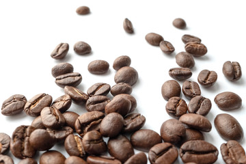 Roasted coffee beans isolated on white background. Close-up.
