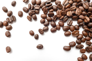 Roasted coffee beans isolated on white background. Close-up.