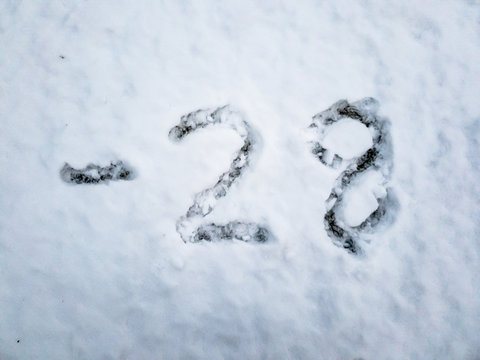 Temperature of -28 written in the freshly fallen snow