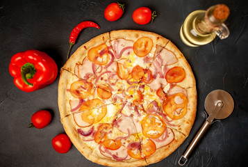 Delicious pizza on a concrete background. Top view of hot pizza.