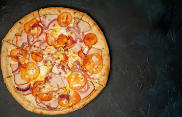 Delicious   pizza on a concrete background. Top view of hot pizza. 