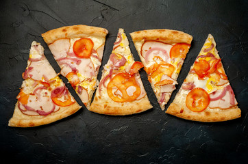 Delicious   pizza on a concrete background. Top view of hot pizza. 