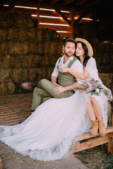 portrait of newlyweds in boho style at ranch