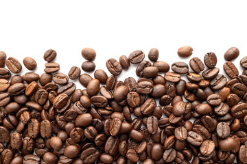 Roasted coffee beans on white background. Close-up.