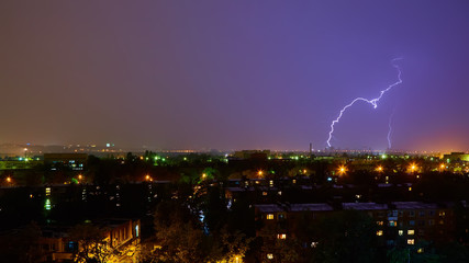 Lightning strike in the city Kyiv. Storm outside. Thunderstorm with lightning in the city. Moment...