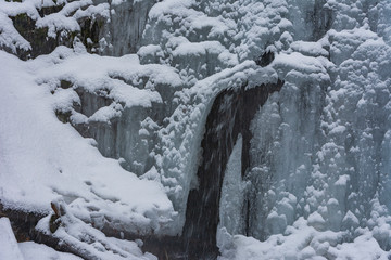 Fototapeta na wymiar frozen waterfall in the mountain