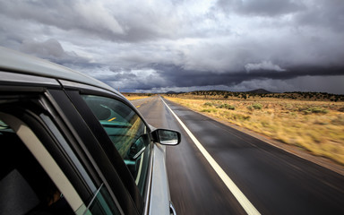 Fototapeta na wymiar USA road trip in car with stormy weather