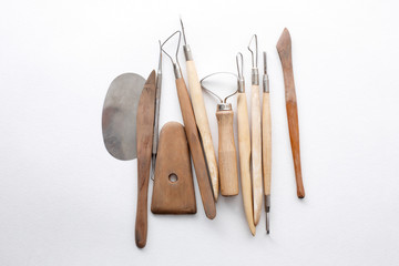 composition of tools for sculptors on white background