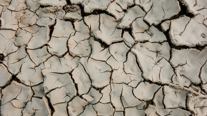 Dry land and cracked ground.