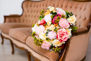 close up of beautiful flowers on vintage sofa