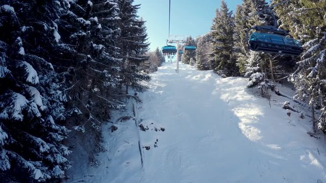 Skiers on beautiful ski slope in Alps, people on winter holidays. Winter mountain landscape