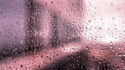 view of the city through wet glass as a background for artists
