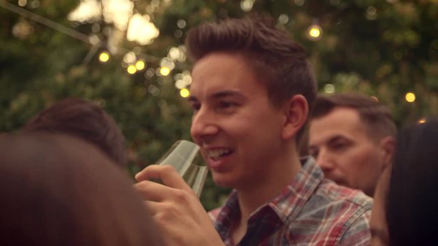 Man drinking wine outside 