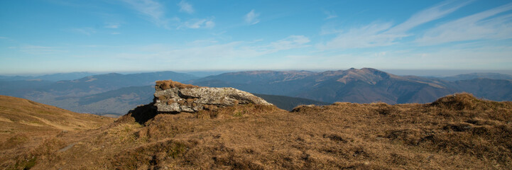 Panoramic view of idyllic mountain scenery in sunny day