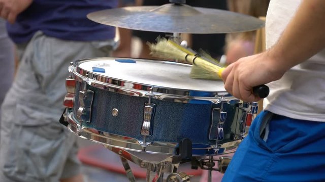 A street muscian playing drums