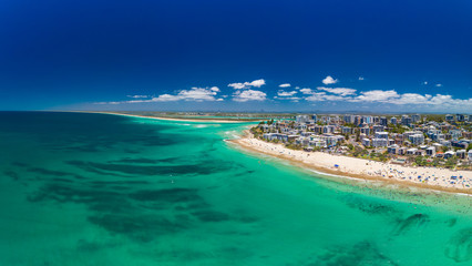 Fototapeta premium Aerial drone panoramic image of ocean waves on a Kings beach, Caloundra, Queensland, Australia