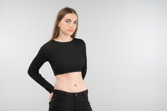 Portrait of  sexy sad  woman posing in the studio in the black  top. Horisontal image
