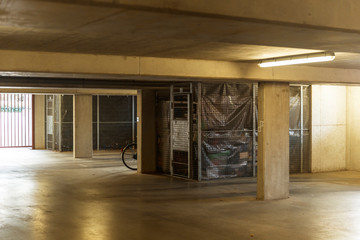 Empty underground car park with personal storage.