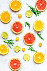 sliced citrus pattern on stone table background top view