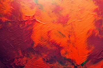 Abstract and colorful acrylic painting with texture details in reds and orange tones