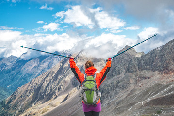 Young woman on the top of mountains