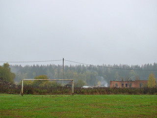 Old football goal on the country field in autumn
