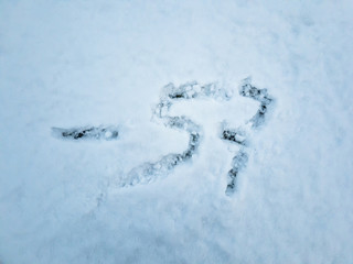 Temperature of -57 written in the freshly fallen snow