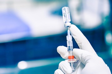 Medical hand gloves dispose medication drug needle syringe drug,concept flu shot vaccine vial dose...