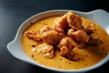 Fried chicken with cheese sauce