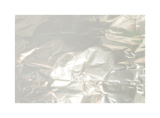 Silver crumpled foil texture isolated on white background