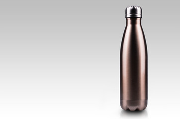 Empty stainless thermo water bottle close-up isolated on white background.