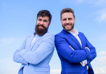 Business people concept. Bearded business people posing confidently. Business men stand blue sky...
