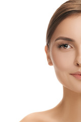 Fototapeta premium The beautiful female face. The perfect and clean skin of face on white. The beauty, care, skin, treatment, health, spa, cosmetic concept
