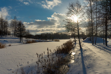 Frozen snow covered river in a winter landscape