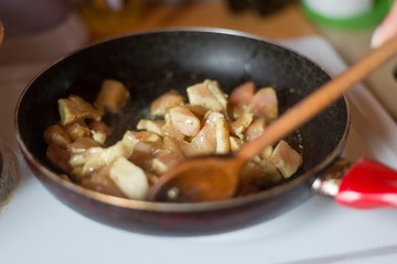 chicken meat cooking in pan.