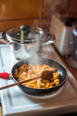 chicken meat cooking in pan.