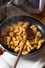chicken meat cooking in pan.
