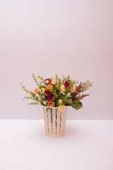 Beautiful artificial flower shot on a plain isolated white background.