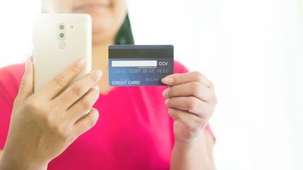 Buy products online By using a mobile phone and paying using a credit card. - Image